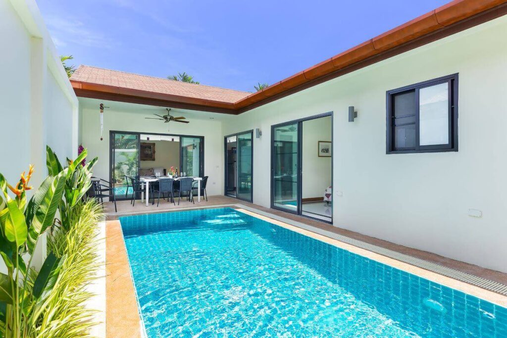 2-bedroom villa for sale in Rawai, Phuket with pool, mountain views, and outdoor dining area
