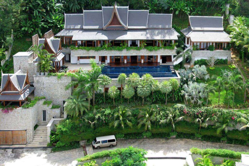 4-bedroom Thai-style villa in Surin, Phuket, with ocean views, infinity pool, and elegant wood interiors.
