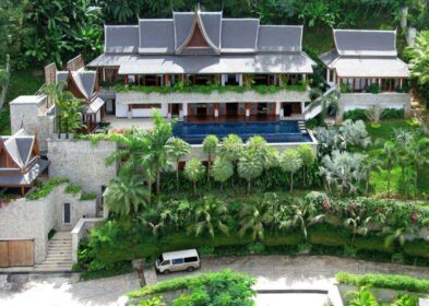 4-bedroom Thai-style villa in Surin, Phuket, with ocean views, infinity pool, and elegant wood interiors.