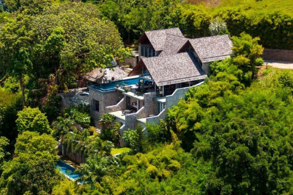 4-bedroom oceanfront villa in Kamala, Phuket, with infinity pool, lap pool, private gym, and panoramic sea views.