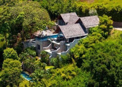 4-bedroom oceanfront villa in Kamala, Phuket, with infinity pool, lap pool, private gym, and panoramic sea views.