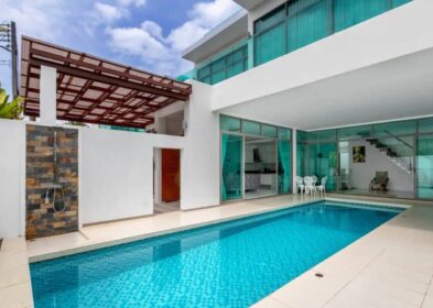 5-bedroom villa for sale near Kamala Beach, Phuket with pool, balconies, and mountain views