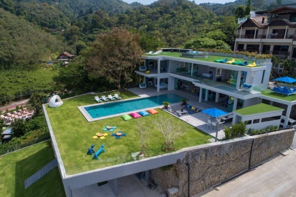 5-bedroom hillside villa in Patong, Phuket, with panoramic sea views, private pool, and luxury entertainment spaces.