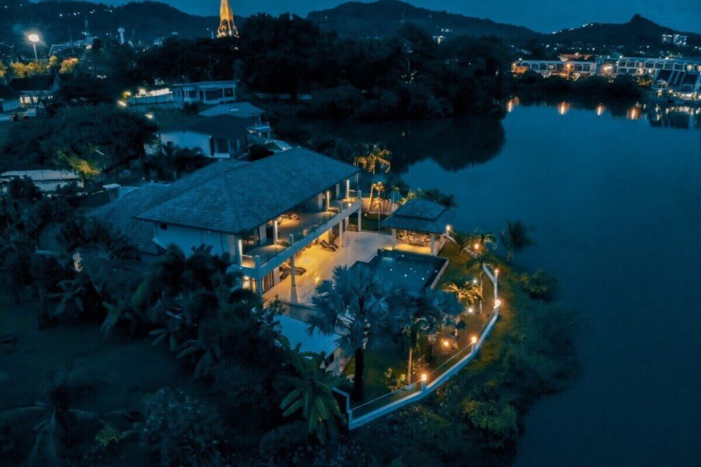 5-bedroom lakefront villa in Chalong with pool, balconies, and garden in gated family estate
