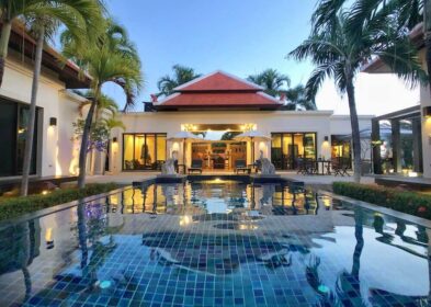 Exquisite 5-bed, 5-bath pool villa near Nai Harn Beach with 1,548 sqm land and 320 sqm build. Features 5 private pavilions, saltwater pool with jacuzzi, tropical landscaping, outdoor kitchen, and high-end finishes.