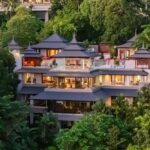 A six-bedroom ultra-luxury villa in Cherng Talay, Phuket, offering a private 21m pool, traditional Thai architecture, and stunning Andaman Sea views.