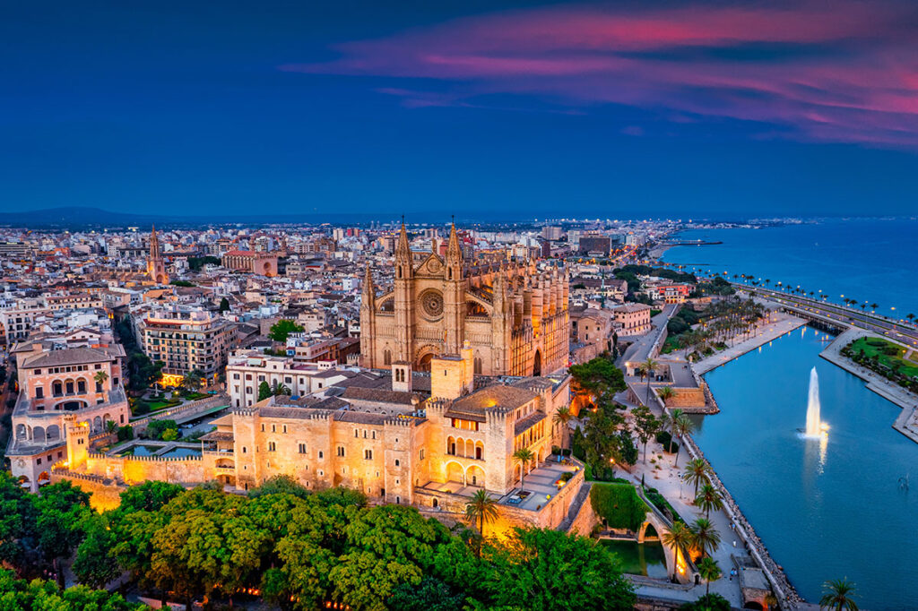 Aerial view of Palma de Mallorca at sunset, highlighting the city’s appeal for property investors in 2025