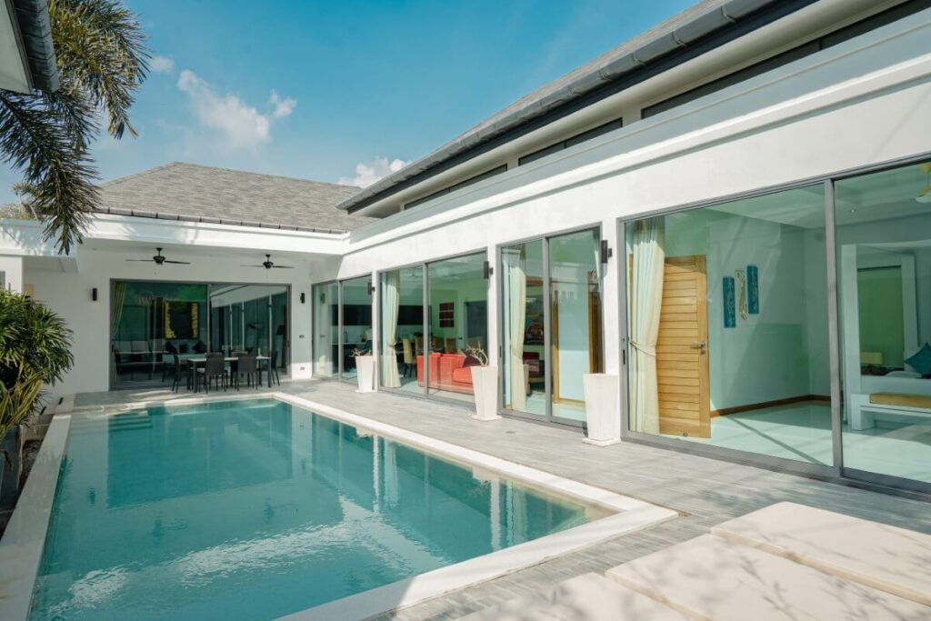 3-Bed Villa for Sale in Rawai, Phuket - Build Area 250 sqm Villa for Sale Rawai, Phuket, Thailand See map € 475,403 3 3 Bedrooms 3 3 Bathrooms 400 sqm Plot Size 250 sqm Built-up Area Villa Property Type REF ID: psv-raw-1623 Property Features Villa / Houses3 bed3 bathAir ConditioningPoolThe Land area is 400 sqmThe built up area is 250 sqmSecure ParkingDeckOutdoor Entertaining Full Description Overview This resale 3-bedroom pool villa in Rawai, Phuket features a clean modern design with a light neutral palette, wide sliding glass panels and a continuous indoor-outdoor connection. The look is complemented by natural wood furniture and subtle Asian-inspired decor, with bolder tones adding contrast against the neutral base. This villa is currently operated as a short-term holiday rental, making it suitable for private residence or rental investment. Layout The villa is set on a 400 sqm plot with an approximate built-up area of 250 sqm, on a single level with undercover parking. Arranged in a U-shape around the pool, the open-plan living, dining and kitchen area, along with all bedrooms, offer direct pool access. Development Overview Completed by a local developer. This boutique independent project is a non-gated development of 9 villas with 2, 3 or 4 bedrooms, with built-up areas ranging from 199 to 480 sqm. Location Located in the Samakki area of Rawai just off Soi Saiyuan. Within a 5-15 minutes are Nai Harn Beach, Yanui Beach, Rawai Beach, Promthep Cape, Chalong Roundabout Clocktower and Chalong Pier. Phuket International Airport is approximately 44 km away or a drive of 1 hour and 20 minutes. For a broader look at the area, view Rawai property for sale. You may also want to explore Rawai villas for sale. Property Features * Villa / Houses * 3 bed * 3 bath * Air Conditioning * Pool * 400 sqm * 250 sqm * Secure Parking * Deck * Outdoor Entertaining * Fully Fenced * Fully Furnished * Private Pool * Resale