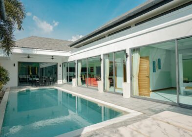 3-Bed Villa for Sale in Rawai, Phuket - Build Area 250 sqm Villa for Sale Rawai, Phuket, Thailand See map € 475,403 3 3 Bedrooms 3 3 Bathrooms 400 sqm Plot Size 250 sqm Built-up Area Villa Property Type REF ID: psv-raw-1623 Property Features Villa / Houses3 bed3 bathAir ConditioningPoolThe Land area is 400 sqmThe built up area is 250 sqmSecure ParkingDeckOutdoor Entertaining Full Description Overview This resale 3-bedroom pool villa in Rawai, Phuket features a clean modern design with a light neutral palette, wide sliding glass panels and a continuous indoor-outdoor connection. The look is complemented by natural wood furniture and subtle Asian-inspired decor, with bolder tones adding contrast against the neutral base. This villa is currently operated as a short-term holiday rental, making it suitable for private residence or rental investment. Layout The villa is set on a 400 sqm plot with an approximate built-up area of 250 sqm, on a single level with undercover parking. Arranged in a U-shape around the pool, the open-plan living, dining and kitchen area, along with all bedrooms, offer direct pool access. Development Overview Completed by a local developer. This boutique independent project is a non-gated development of 9 villas with 2, 3 or 4 bedrooms, with built-up areas ranging from 199 to 480 sqm. Location Located in the Samakki area of Rawai just off Soi Saiyuan. Within a 5-15 minutes are Nai Harn Beach, Yanui Beach, Rawai Beach, Promthep Cape, Chalong Roundabout Clocktower and Chalong Pier. Phuket International Airport is approximately 44 km away or a drive of 1 hour and 20 minutes. For a broader look at the area, view Rawai property for sale. You may also want to explore Rawai villas for sale. Property Features * Villa / Houses * 3 bed * 3 bath * Air Conditioning * Pool * 400 sqm * 250 sqm * Secure Parking * Deck * Outdoor Entertaining * Fully Fenced * Fully Furnished * Private Pool * Resale