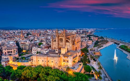 Aerial view of Palma de Mallorca at sunset, highlighting the city’s appeal for property investors in 2025