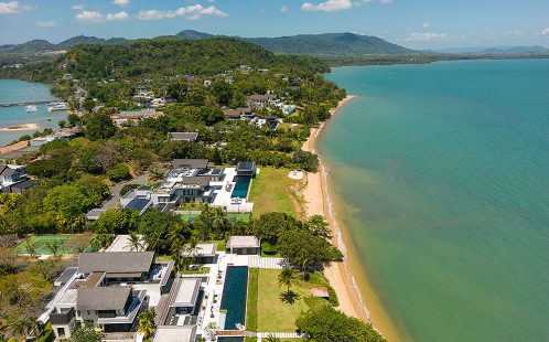 Scenic view of Cape Yamu, Phuket, showcasing its tranquil waterfront, lush greenery, and stunning coastal landscape.